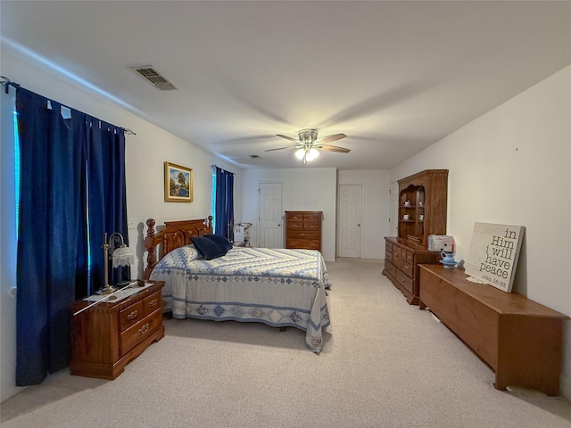 5325 County Road 2691, Buffalo, TX 75831 - bedroom featuring visible vents, a ceiling fan, and light carpet