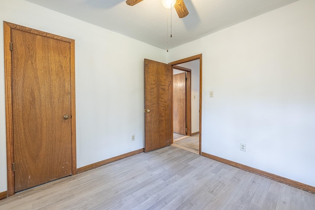 9847 N Lake Vw, Montgomery, TX 77316 - unfurnished bedroom featuring light wood-type flooring, baseboards, and a ceiling fan