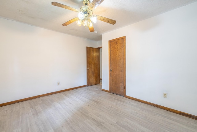 9847 N Lake Vw, Montgomery, TX 77316 - unfurnished room with light wood-type flooring, baseboards, and a ceiling fan
