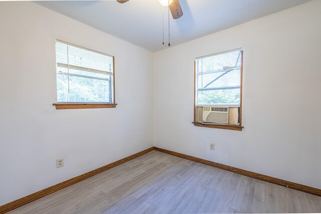 9847 N Lake Vw, Montgomery, TX 77316 - unfurnished room featuring light wood finished floors, baseboards, a ceiling fan, and cooling unit