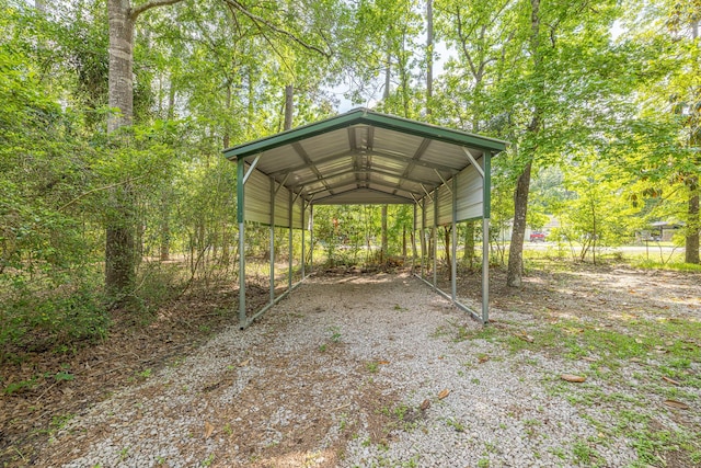 9847 N Lake Vw, Montgomery, TX 77316 - view of vehicle parking with a detached carport and driveway