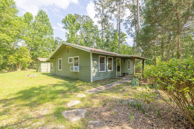 9847 N Lake Vw, Montgomery, TX 77316 - view of home's exterior featuring a lawn, a shed, and an outdoor structure