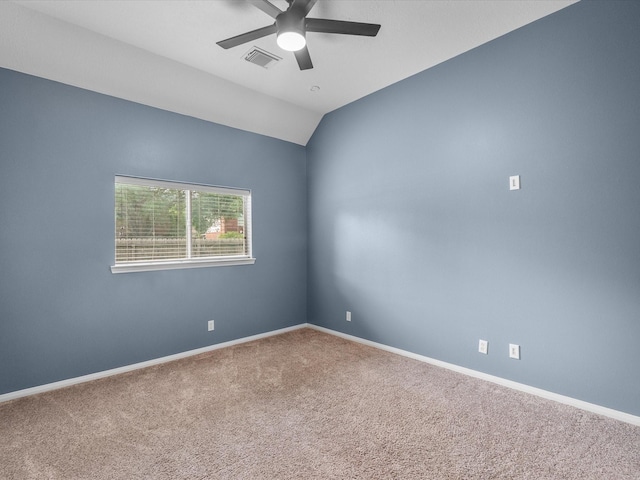 empty room with visible vents, a ceiling fan, carpet, and baseboards