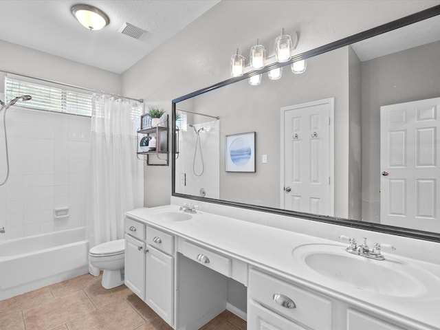 bathroom with a sink, shower / tub combo with curtain, toilet, and visible vents