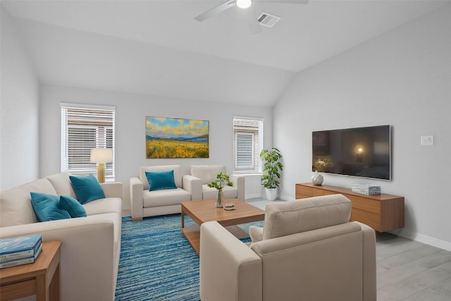 living area featuring a ceiling fan, visible vents, light wood-type flooring, baseboards, and lofted ceiling
