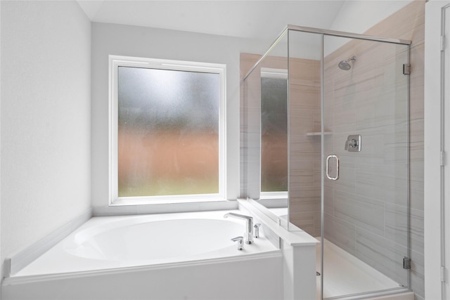 bathroom featuring a garden tub and a stall shower