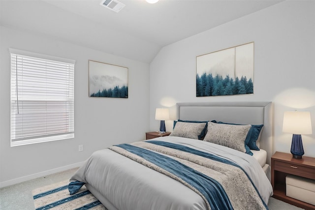 bedroom with baseboards, visible vents, carpet, and lofted ceiling