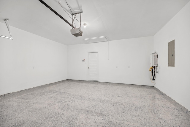 garage featuring a garage door opener and electric panel