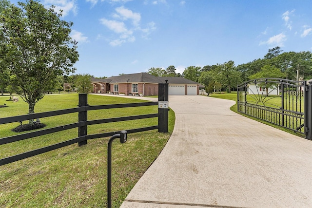 33519 Hillside Dr, Pinehurst, TX 77362 - ranch-style home featuring concrete driveway and an attached garage