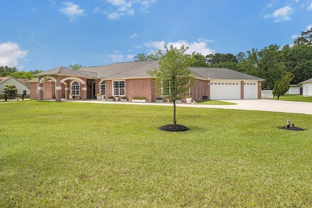33519 Hillside Dr, Pinehurst, TX 77362 - ranch-style house featuring concrete driveway, a front lawn, an attached garage, and brick siding