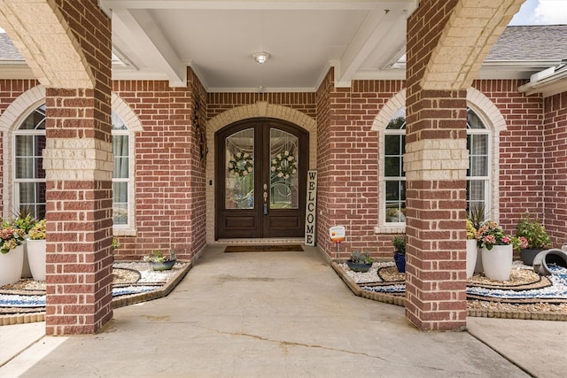 33519 Hillside Dr, Pinehurst, TX 77362 - property entrance featuring french doors and brick siding