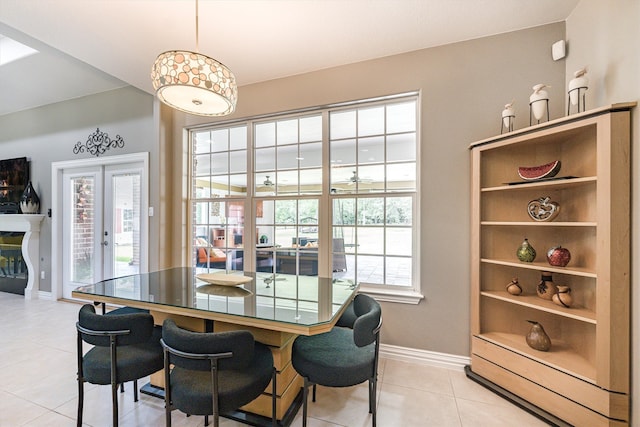 33519 Hillside Dr, Pinehurst, TX 77362 - dining space with light tile patterned flooring, baseboards, and french doors
