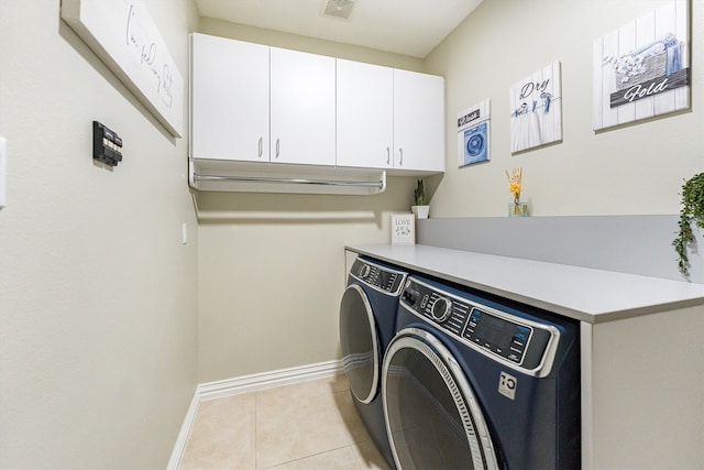 33519 Hillside Dr, Pinehurst, TX 77362 - washroom featuring cabinet space, independent washer and dryer, baseboards, and light tile patterned floors