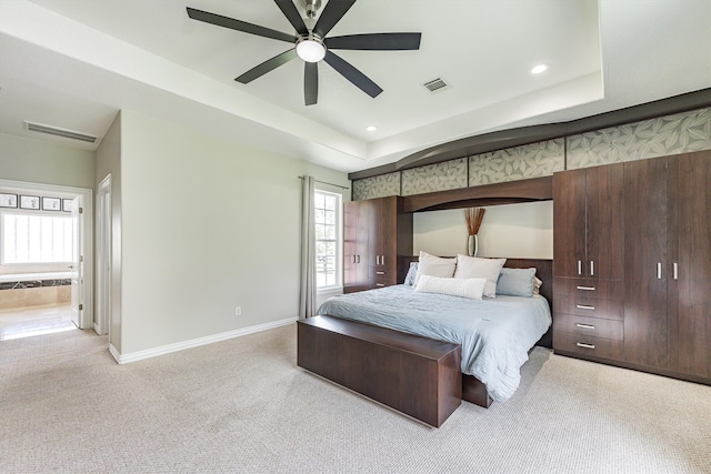 33519 Hillside Dr, Pinehurst, TX 77362 - bedroom with light carpet, a tray ceiling, baseboards, recessed lighting, and a ceiling fan