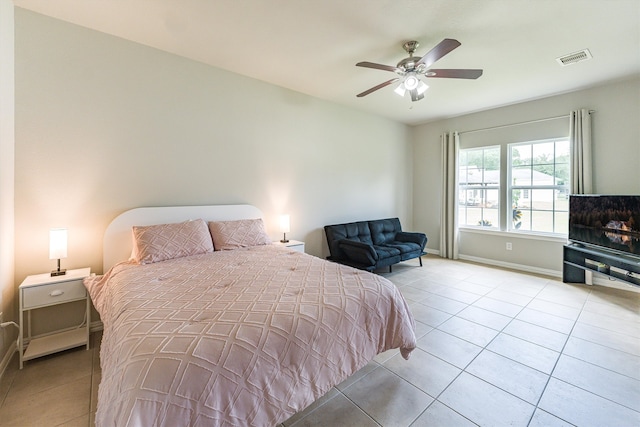 33519 Hillside Dr, Pinehurst, TX 77362 - bedroom with light tile patterned flooring, baseboards, and a ceiling fan