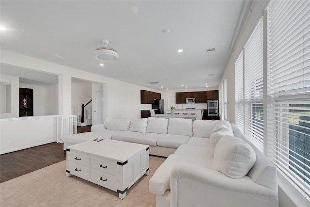 25553 Kensington Lake Dr, Porter, TX 77365 - living area featuring light wood-type flooring, recessed lighting, stairs, and visible vents