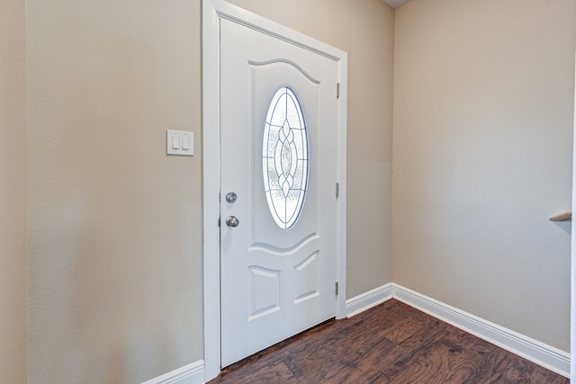 entryway with baseboards and dark wood finished floors