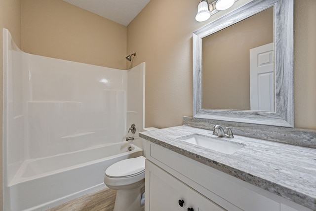 bathroom with shower / bath combination, vanity, toilet, and wood finished floors