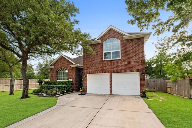traditional-style house featuring a garage, fence, driveway, and brick siding