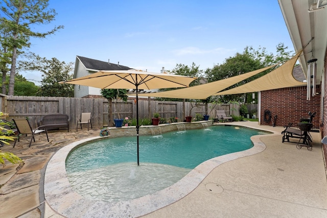 view of pool with a patio, a fenced in pool, and a fenced backyard