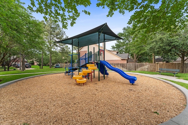 community jungle gym featuring fence