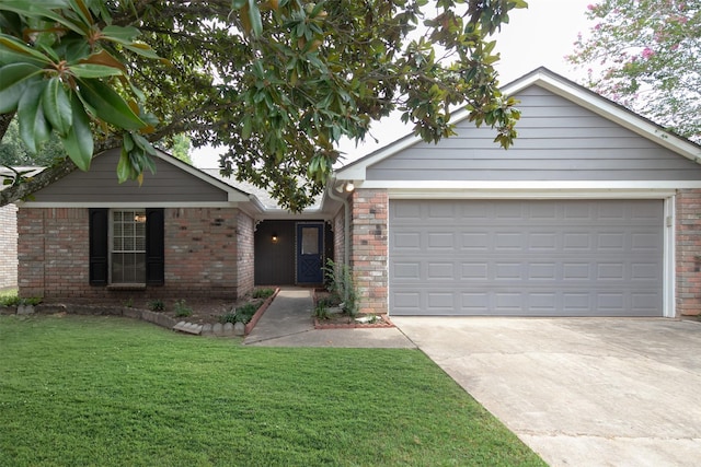 single story home with brick siding, an attached garage, driveway, and a front yard