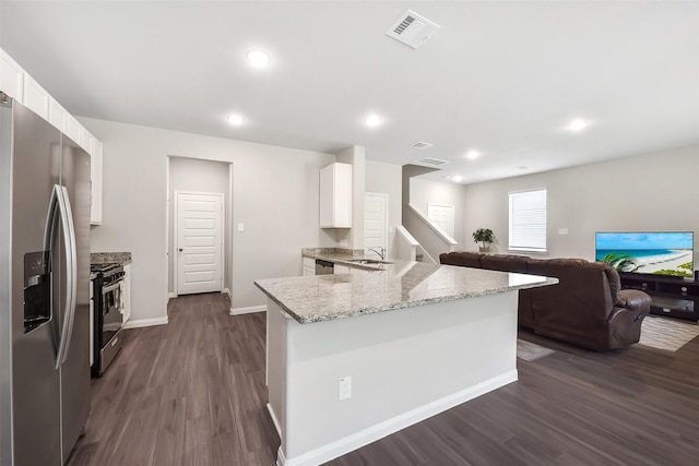 kitchen with stainless steel appliances, dark wood-style flooring, white cabinetry, and visible vents