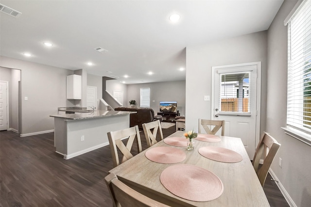 dining room featuring baseboards, visible vents, recessed lighting, and dark wood-type flooring