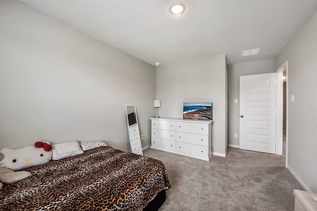 bedroom featuring baseboards, visible vents, and carpet