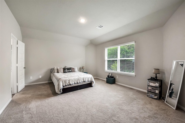 carpeted bedroom featuring baseboards and visible vents