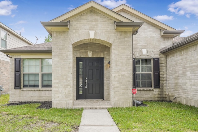 29634 Legends Line Dr, Spring, TX 77386 - property entrance featuring brick siding, a shingled roof, and a yard