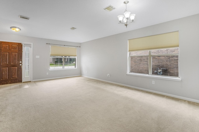 29634 Legends Line Dr, Spring, TX 77386 - unfurnished room with carpet flooring, baseboards, a chandelier, and visible vents