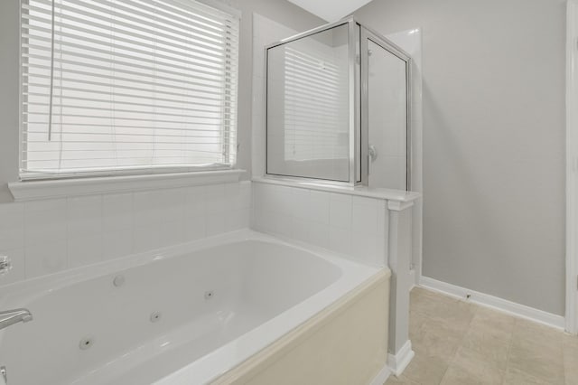 29634 Legends Line Dr, Spring, TX 77386 - full bathroom featuring a jetted tub, baseboards, and a shower stall