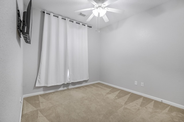 29634 Legends Line Dr, Spring, TX 77386 - carpeted spare room with baseboards, a ceiling fan, and visible vents