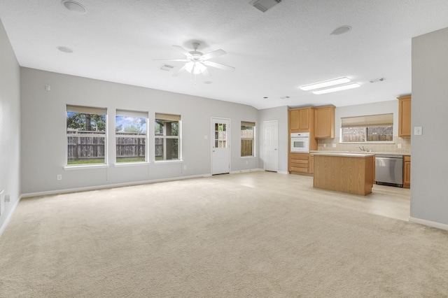 29634 Legends Line Dr, Spring, TX 77386 - unfurnished living room with baseboards, ceiling fan, visible vents, and light carpet