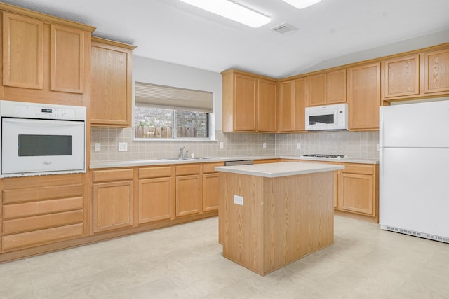 29634 Legends Line Dr, Spring, TX 77386 - kitchen featuring white appliances, light floors, lofted ceiling, and light countertops