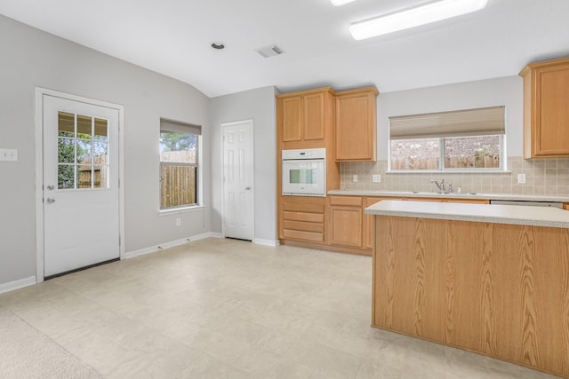 29634 Legends Line Dr, Spring, TX 77386 - kitchen with light countertops, oven, a sink, and backsplash