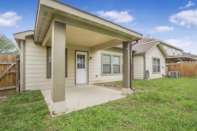 29634 Legends Line Dr, Spring, TX 77386 - rear view of house with a lawn, fence, central AC unit, and a patio area