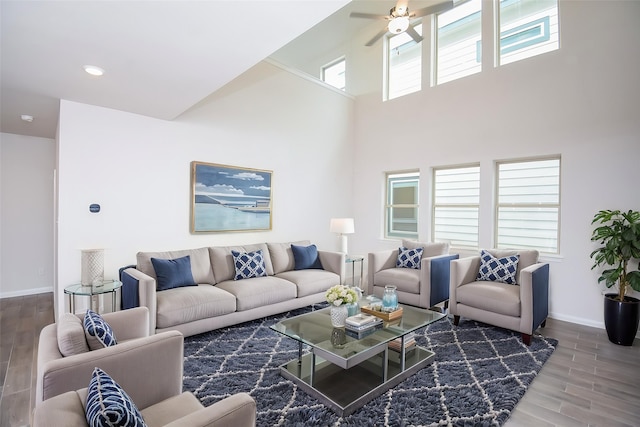 14519 Aston Pines Dr, Houston, TX 77032 - living area with baseboards, a high ceiling, a ceiling fan, and wood finished floors