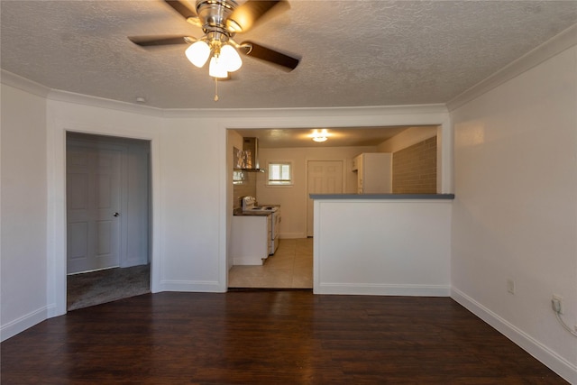 unfurnished living room featuring baseboards, a ceiling fan, a textured ceiling, and wood finished floors