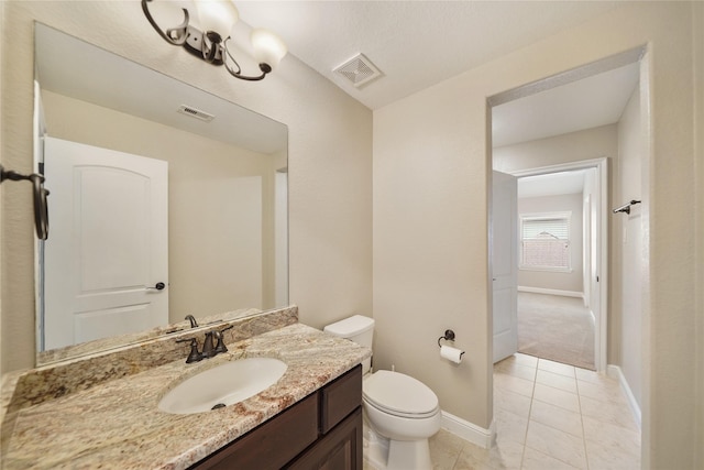 bathroom featuring baseboards, tile patterned floors, toilet, and visible vents