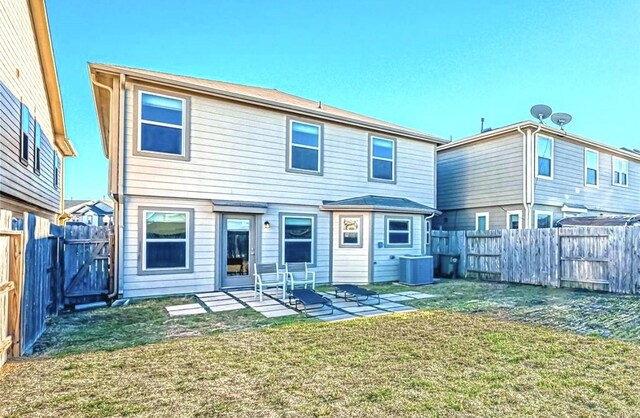 rear view of house with central AC, a fenced backyard, a gate, a patio area, and a yard