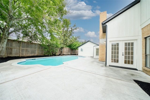 view of pool featuring a patio, a fenced in pool, french doors, and a fenced backyard