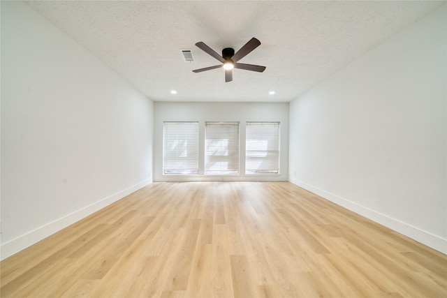 7906 Duffield Ln, Houston, TX 77071 - empty room featuring ceiling fan, light wood-style flooring, a textured ceiling, baseboards, and recessed lighting