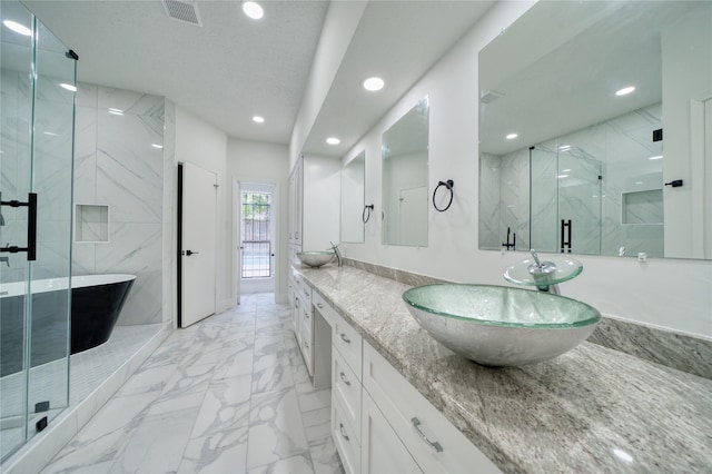 full bathroom with visible vents, a sink, marble finish floor, a marble finish shower, and recessed lighting