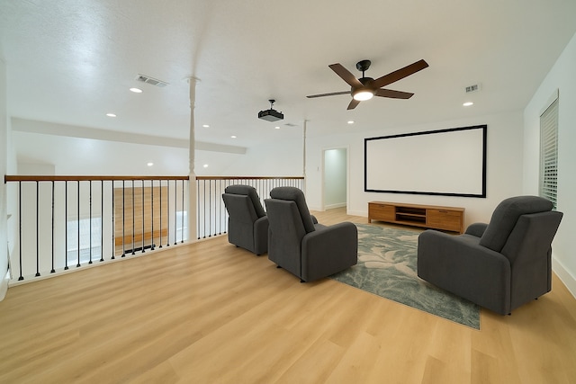 cinema room with visible vents, recessed lighting, ceiling fan, and wood finished floors