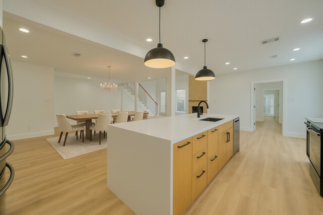 7906 Duffield Ln, Houston, TX 77071 - kitchen with a sink, modern cabinets, light wood-type flooring, stainless steel dishwasher, and recessed lighting