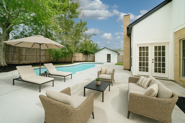 7906 Duffield Ln, Houston, TX 77071 - view of pool featuring french doors, a patio, a fenced backyard, an outdoor living space, and a shed