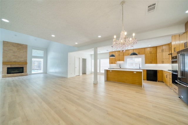 7906 Duffield Ln, Houston, TX 77071 - unfurnished living room with a chandelier, light wood-style flooring, recessed lighting, a large fireplace, and baseboards