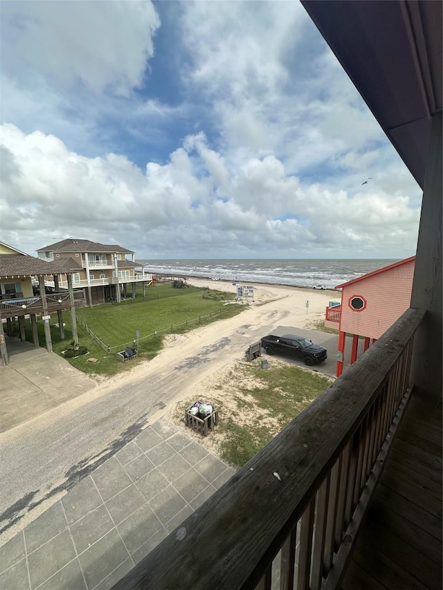 exterior space with a water view and a view of the beach